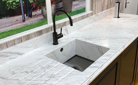 meganite solid surface countertops and kitchen sink with fancy edge